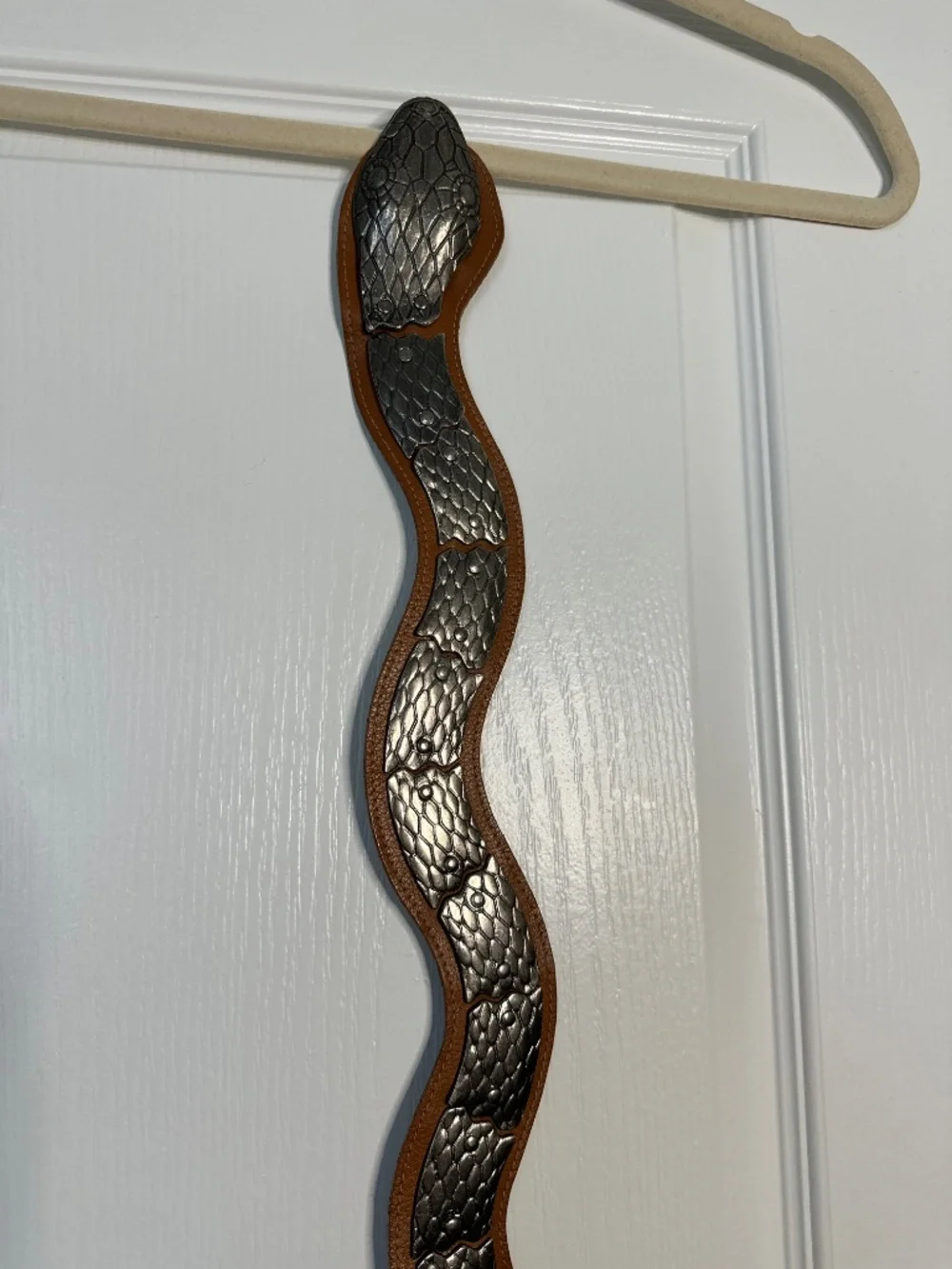 Vintage brown leather and silver colored metal articulated snake belt